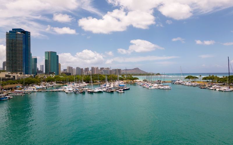 Aerial view of the Ala Wai harbor with boats, the Honolulu skyline and Diamond Head on Oahu, Hawaii