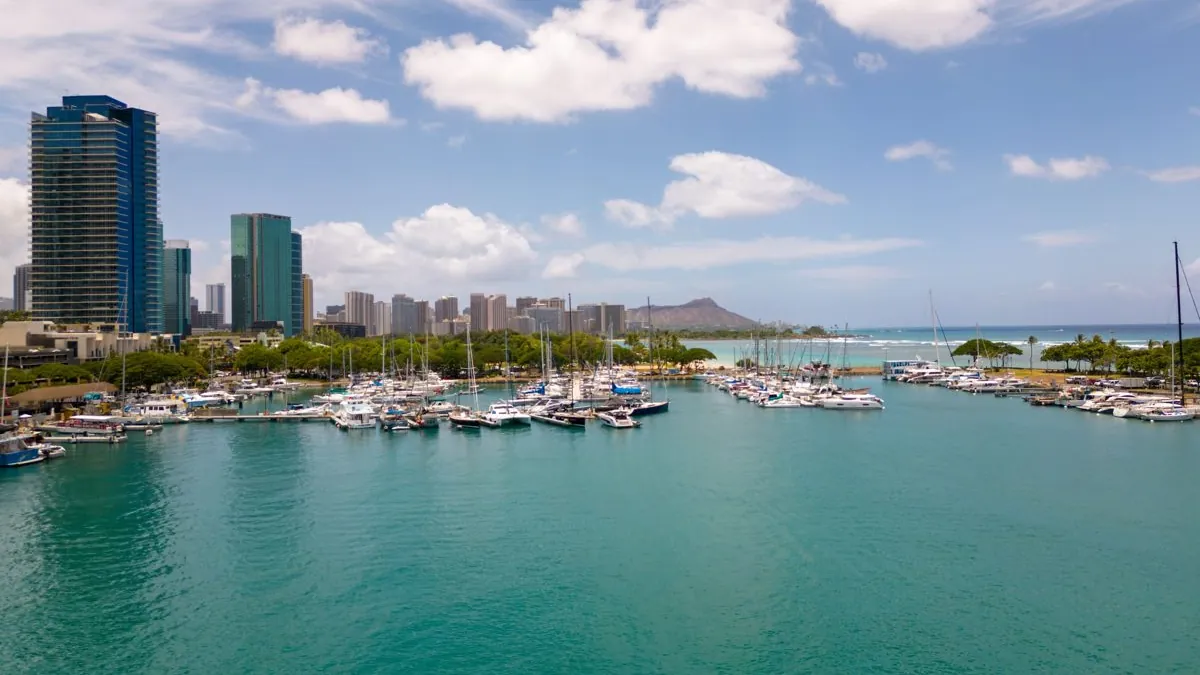 Aerial view of a boat harbor with the Honolulu skyline and Diamond Head, Oahu, Hawaii