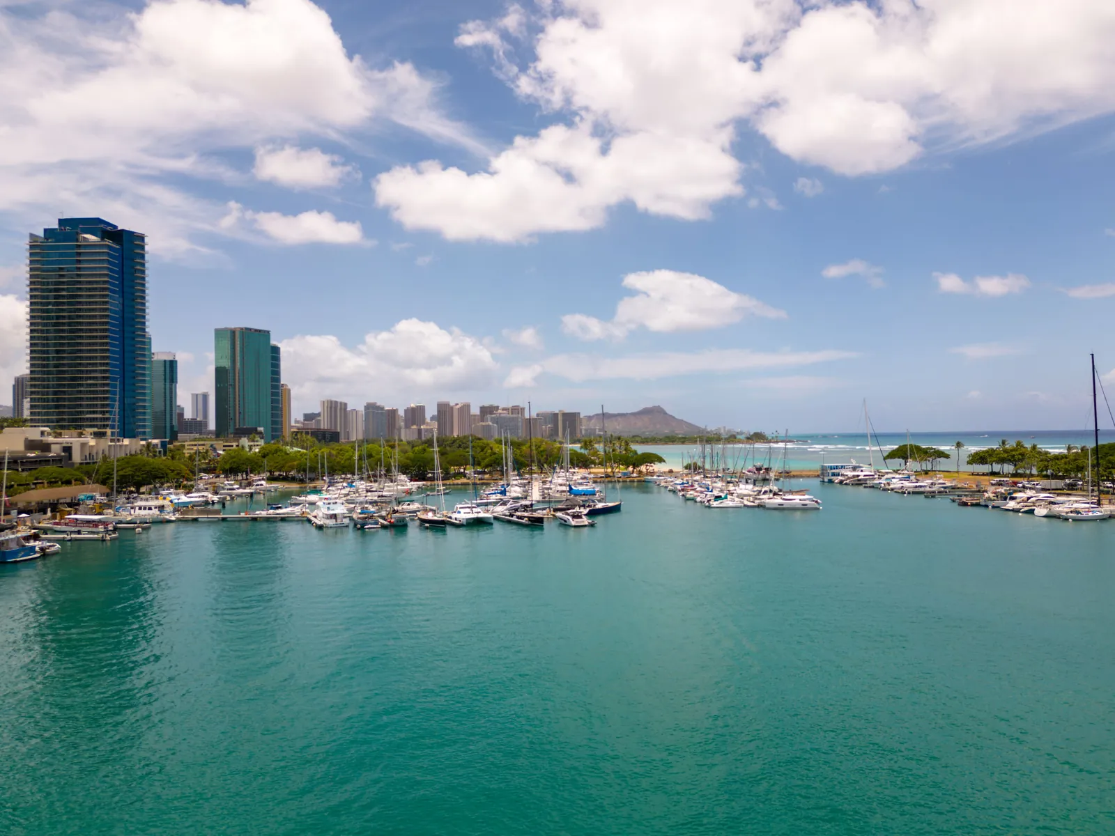 Aerial view of the Honolulu waterfront and harbor full of boats, Oahu