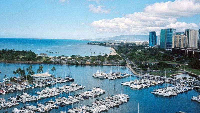 Aerial view of Ala Wai Harbor packed with boats and the Honolulu skyline beyond, Oahu, Hawaii